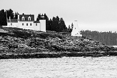 Tenants Harbor Lightouse Over Rocky Shore in Maine -BW